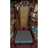 A Caroleon and later walnut caneback padseat elbow chair; together with a similar oak and walnut