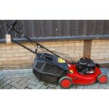 A Briggs & Stratton Champion 375 petrol driven lawn mower, with grass collecting box