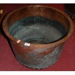 An early 20th century copper circular log bucket, with flattened rim and of typical riveted form,