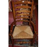 A set of five early 20th century oak and elm rush seat ladderback dining chairs (3+2)