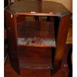 A 1930s mahogany two-tier book table, having canted corners, w.53cm