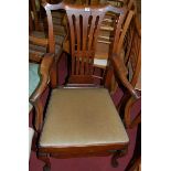 A 19th century walnut Chippendale style splatback single elbow chair, having an upholstered drop-