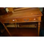 A reproduction yew wood crossbanded two drawer side table, on fluted supports, w.91.5cm