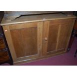 An early 20th century light oak low double door side cupboard, width 103cm