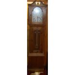 A contemporary pine long case clock, the arched dial signed Ely, with glazed trunk door and three