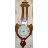 An Art Nouveau mahogany and satinwood strung two dial aneroid wheel barometer