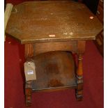 An early 20th century hammered copper clad oak two-tier occasional table, w.46cm