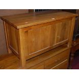 A contemporary blond oak twin panelled hinge topped blanket box, w.92cm