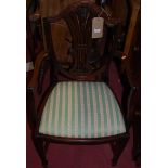 A pair of mahogany Heppelwhite style dining chairs, having stripe upholstered drop-in padseats;