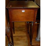 An Edwardian mahogany and satinwood inlaid work table, having twin hinged fold over top, width 39.