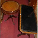 A reproduction mahogany and gilt tooled leather inset round cornered low occasional table;
