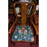 An early 20th century walnut and figured walnut single splatback open armchair, in the Queen Anne