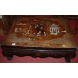 A chinoiserie lacquered low occasional table, having hardstone and mother of pearl inset figure