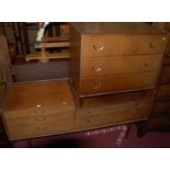 A 1970s Meredew teak chest of three long drawers on turned supports, width 76cm; together with a