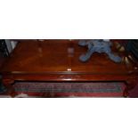 A reproduction mahogany low coffee table, length 136cm