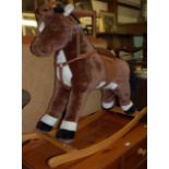 A contemporary plush child's rocking horse