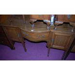 An Edwardian mahogany and satinwood inlaid ledgeback bowfront sideboard, having single central