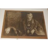 An Edwardian portrait photographic print, in heavy oak frame; together with an amateur landscape