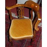 A pair of Edwardian mahogany conch-shell inlaid and further boxwood strung corner elbow chairs