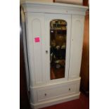 A Victorian and later white painted single mirror door wardrobe, having single long lower drawer,
