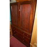 A 19th century mahogany linenpress, the twin upper doors (with stained panels) enclosing linen