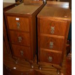 A pair of Art Deco walnut and figured walnut ledgeback three drawer bedside chests (adapted), w.31.