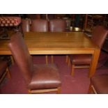 A large contemporary joined oak rectangular dining table, raised on square supports, length 261cm;