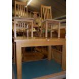 A contemporary light oak dining suite, comprising; extending dining table with pull-out action and