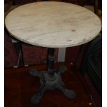 A black painted cast iron and white variegated marble topped circular pedestal pub table, dia.63.