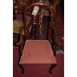 An Edwardian mahogany salon suite, comprising; pair of elbow chairs and four side chairs (with