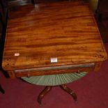A Regency mahogany and ebony strung round cornered work table, the single frieze drawer (with