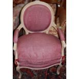 A French limed beech fauteuil in the Louis XV style, w.62cm; together with a white painted wicker