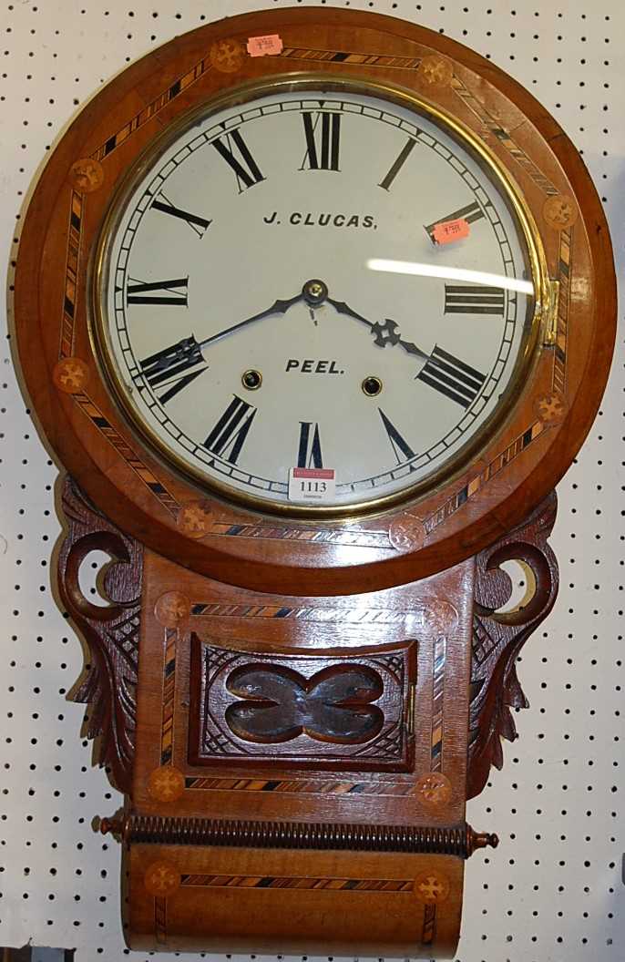 A Victorian figured walnut and inlaid circular drop trunk wall clock, the dial signed J Clucas,