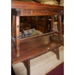 A Spanish stained pine two drawer low coffee table, length 140cm; together with a matching fold-over