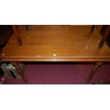 A stained pine rectangular kitchen table, having single end drawer and raised on turned supports,