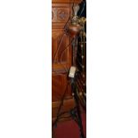 An Art Nouveau black painted wrought iron and copper inset telescopic standard lamp, the rise and