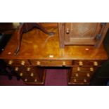 A mid-Victorian satinwood round cornered ledge back twin pedestal writing desk, having an