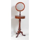 An early Victorian mahogany gentleman's pedestal shaving mirror, having telescopic and hinged
