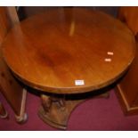 An Eastern hardwood circular low occasional table, raised on carved standing elephant supports,