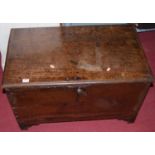 An 18th century oak six plank low chest, the hinge cover enclosing twin drawer interior, width