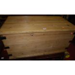 A planked pine and metal bound hinge-top tool chest, having iron end carry handles, w.92.5cm