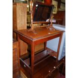 An Edwardian faded mahogany rectangular occasional table, having book trough undertier; together
