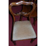 A set of four Victorian rosewood balloon back salon chairs, each having upholstered drop-in padseats