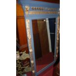 A relief carved oak, later painted and gilt decorated large carved showframe bevelled wall mirror (