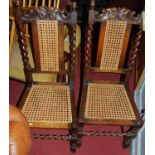 A set of ten early 20th century barley twist turned oak cane back and seat dining chairs, each