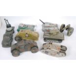 A collection of loose tinplate, clockwork and battery operated military and space tinplate toys