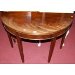 A 19th century mahogany and flame mahogany demi-lune fold-over tea table, having gateleg rear