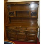 A contemporary Old Charm linenfold oak and lead glazed dresser, w.136cm