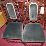 A pair of Victorian rosewood salon side chairs, each having floral carved and pierced detail