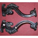 A pair of 19th century floral carved mahogany S scroll supports, each length 51.5cm